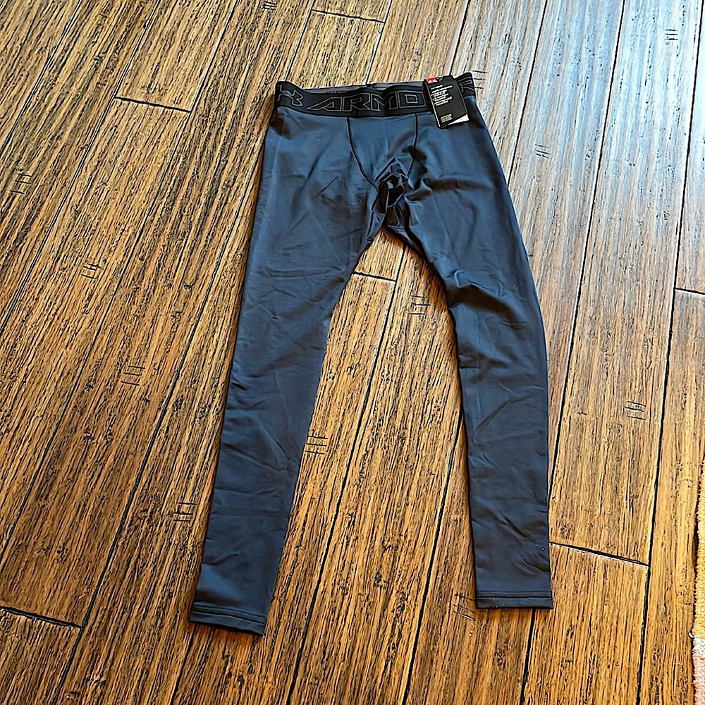 Under Armour cold gear compression tights. Never worn, with tags
